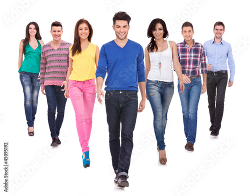 young casual people walking forward