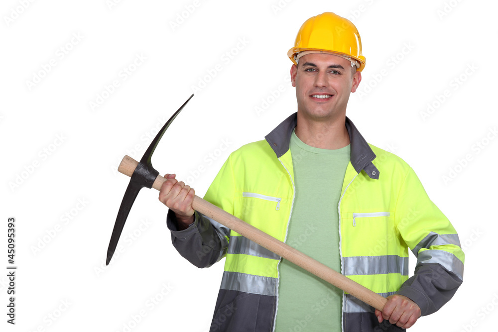 portrait of worker holding pickaxe portrait of worker holding pickaxe