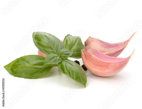 Garlic clove and basil leaf