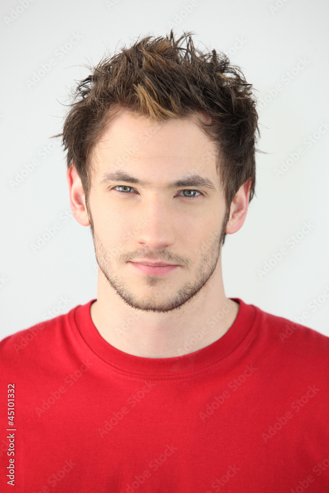 portrait of young man with neutral expression portrait of young man with neutral expression