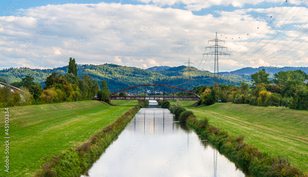 Kinzig river and Black Forest mountains in Offenburg, Germany Kinzig river and Black Forest mountains in Offenburg, Germany