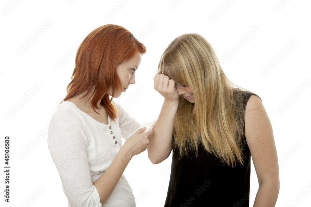 young beautiful red and blond haired girls consoling young beautiful red and blond haired girls consoling