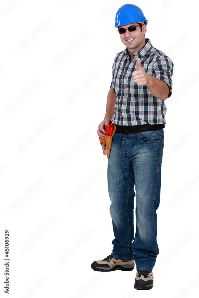 Thumbs up from a construction worker wearing shades Thumbs up from a construction worker wearing shades