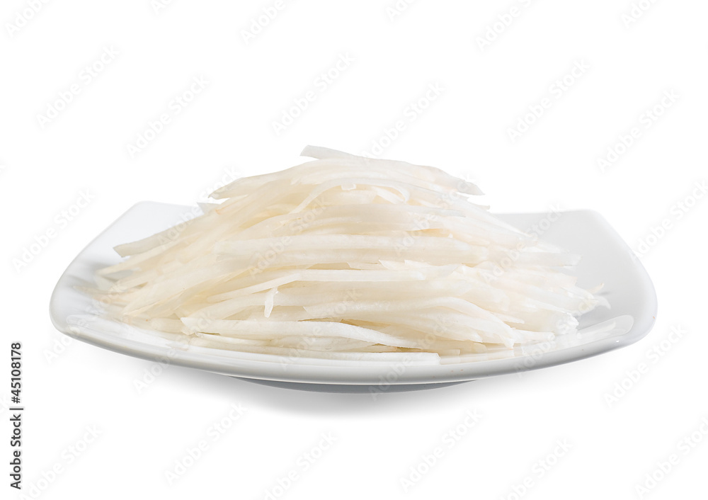 sliced white Chinese radish ready for cooking on the dish sliced white Chinese radish ready for cooking on the dish