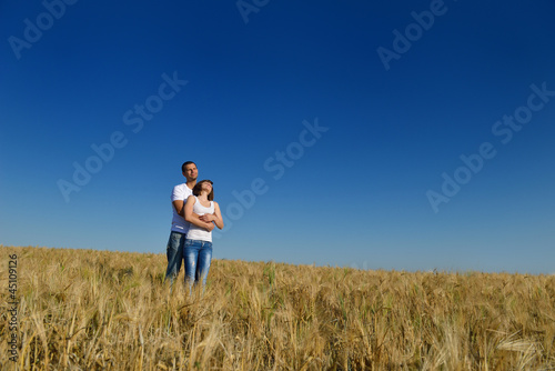 happy couple in wheat field © .shock