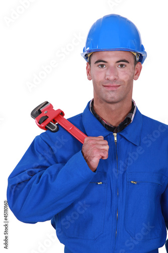 portrait of electrician holding adjustable spanner