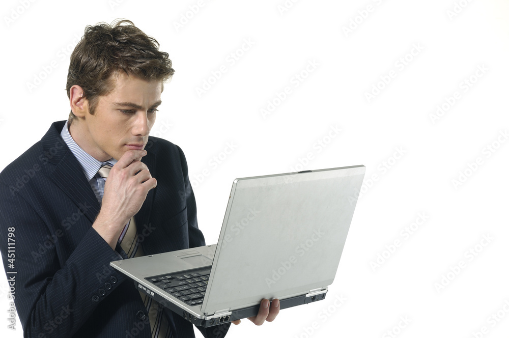 Young businessman using a laptop computer Young businessman using a laptop computer