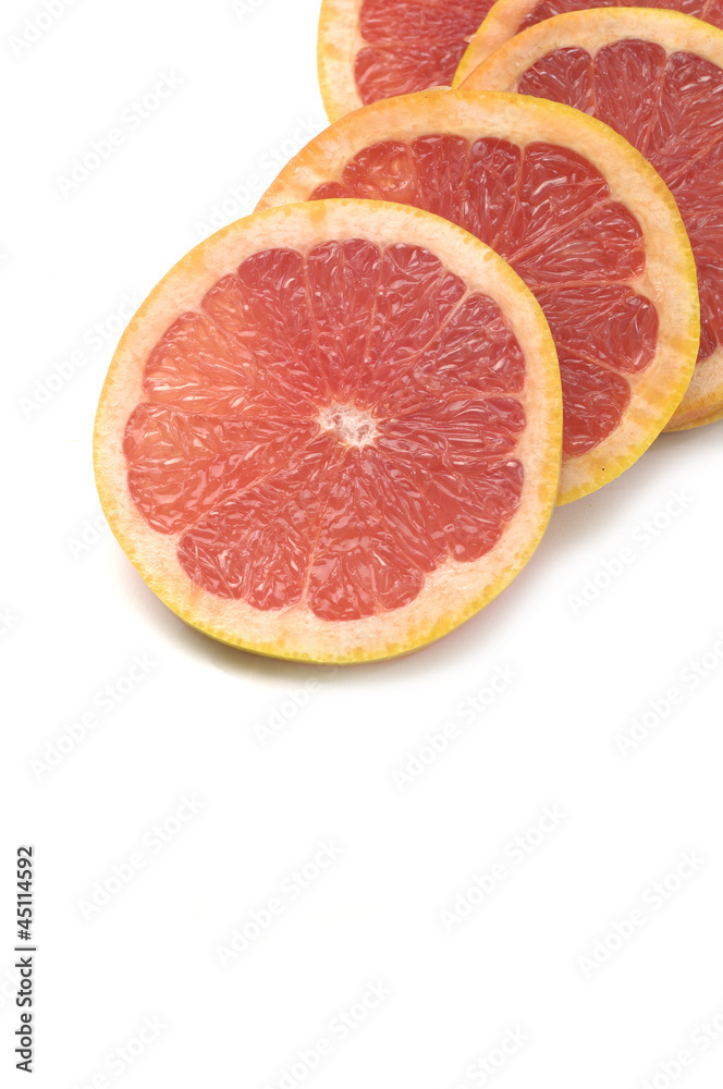 Fresh grapefruit cut in pieces border Fresh grapefruit cut in pieces border