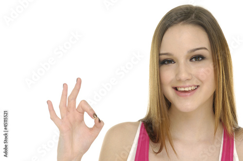 Young woman doing the ok sign isolated