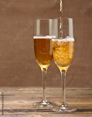 Champagne pouring in glass