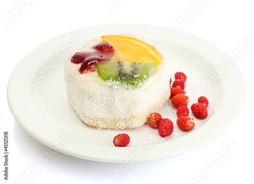 sweet cake with fruits on plate isolated on white