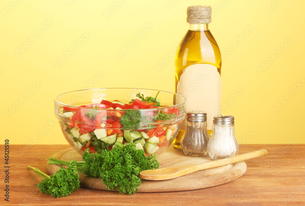 Fresh salad and oil on green background Fresh salad and oil on green background