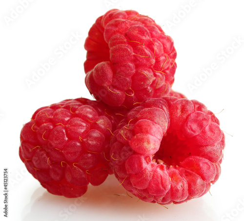 ripe raspberries isolated on white