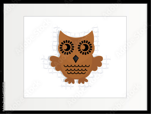 brown wooden owl in frame
