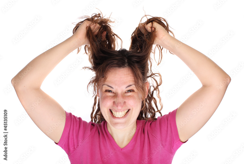 Young smiling tearing her hair Young smiling tearing her hair