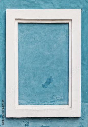 white frame on blue wall