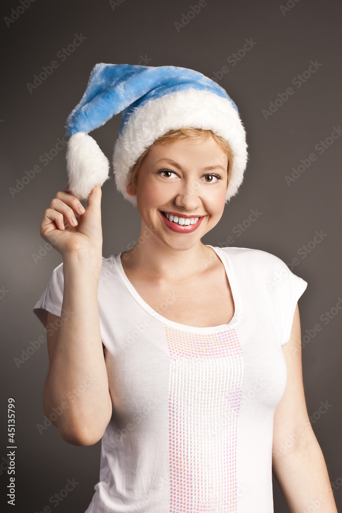 Christmas woman in santa hat. studio shot over white background Christmas woman in santa hat. studio shot over white background