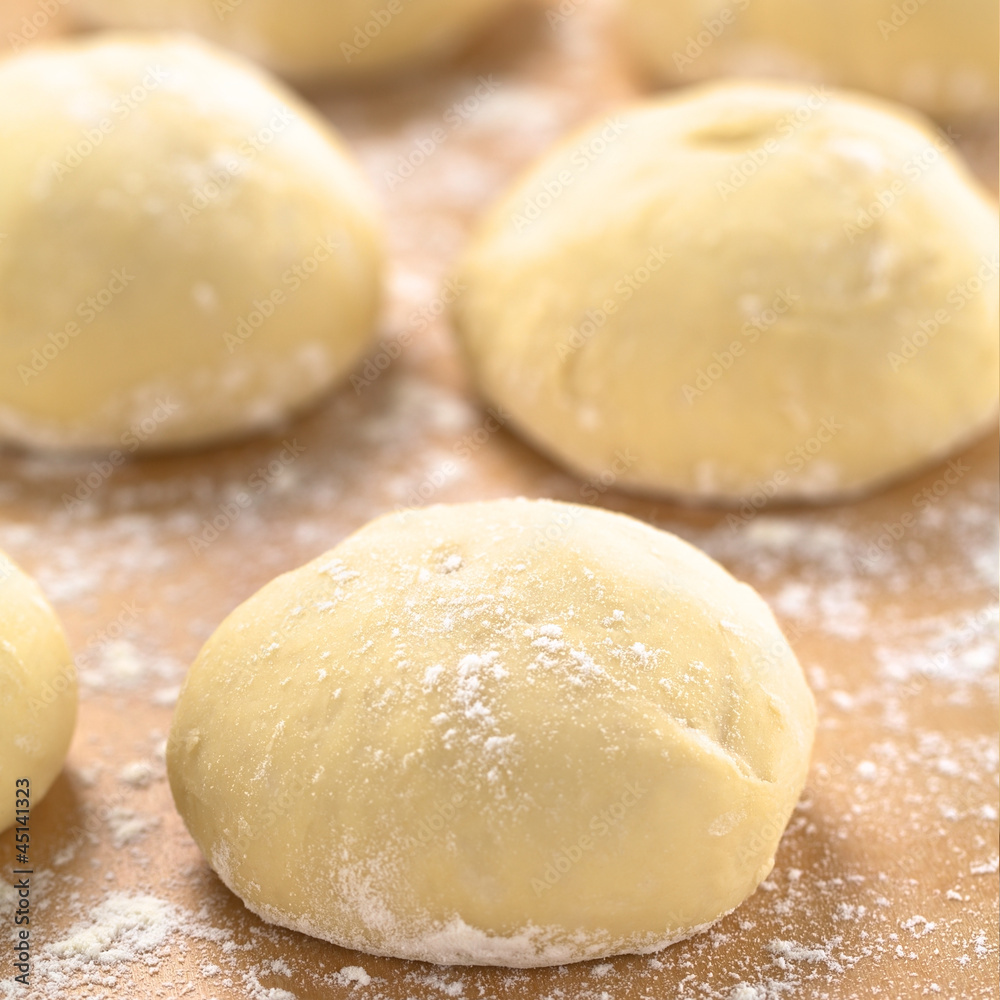 Small balls of fresh homemade pizza dough Small balls of fresh homemade pizza dough