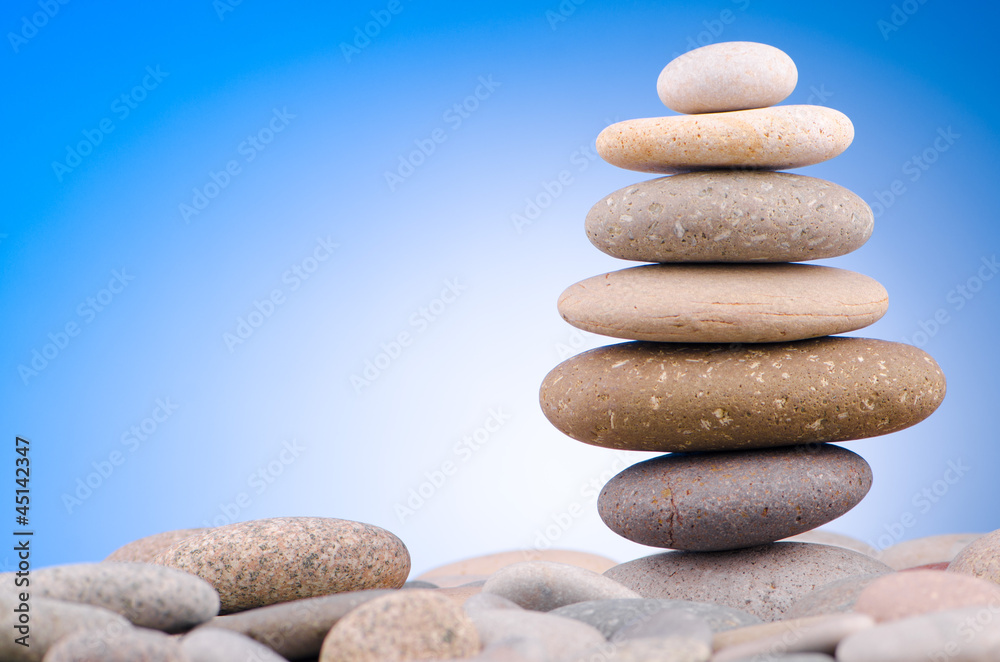 Pebbles stack against gradient background Pebbles stack against gradient background