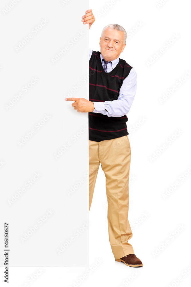 Full length portrait of a gentelman pointing on a banner Full length portrait of a gentelman pointing on a banner