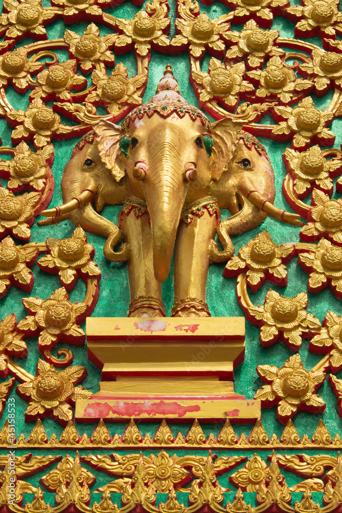 Thai elephant statues in the temple door. Thai elephant statues in the temple door.
