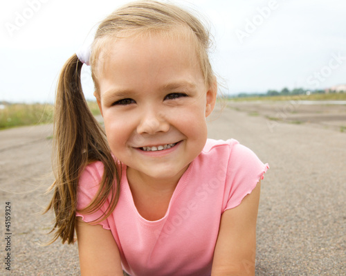 Outdoor portrait of a little girl © Serhiy Kobyakov