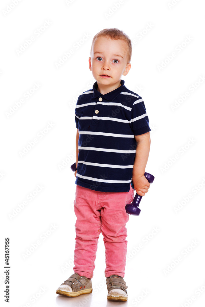 Portrait of handsome kid posing in studio with dumbbells Portrait of handsome kid posing in studio with dumbbells