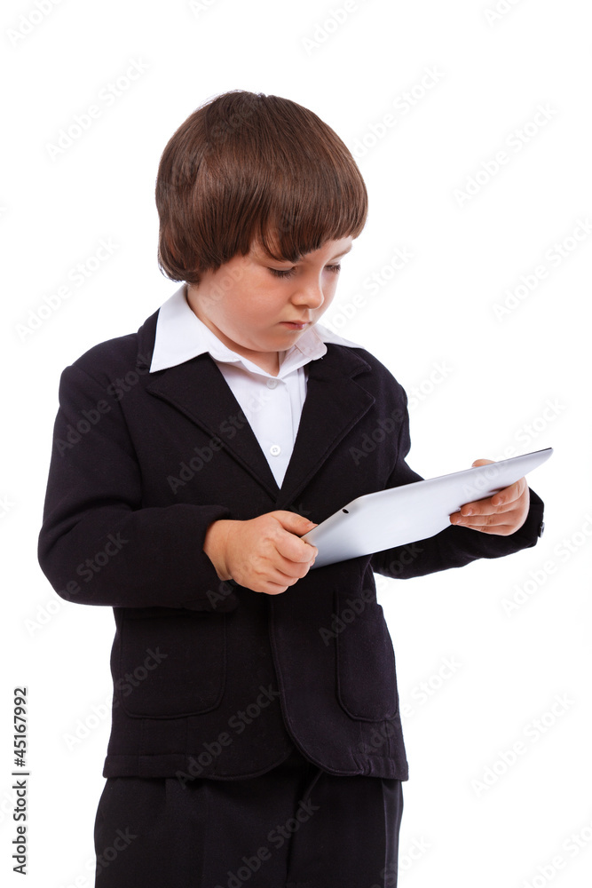 Portrait of handsome kid posing in studio with ipad
