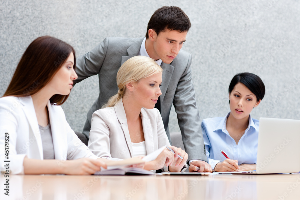 Business people discuss something at the meeting Business people discuss something at the meeting