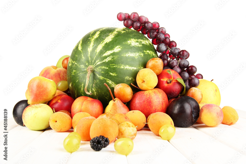 Still life of fruit on wooden table isolated on white Still life of fruit on wooden table isolated on white