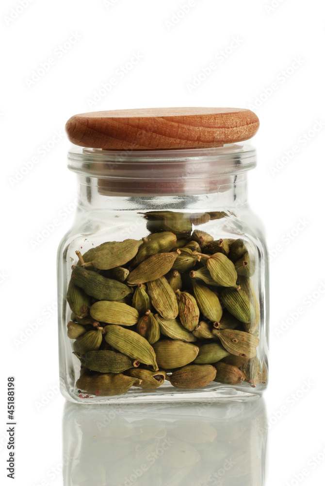 Jar of cardamom isolated on white close-up Jar of cardamom isolated on white close-up