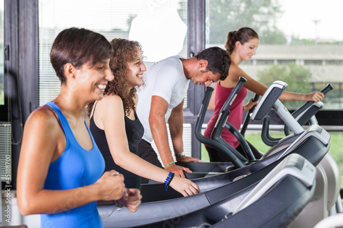 People Running on Treadmill in the Gym © william87