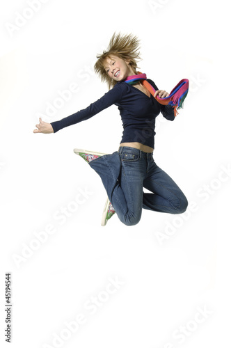 Happy young woman jumping on white
