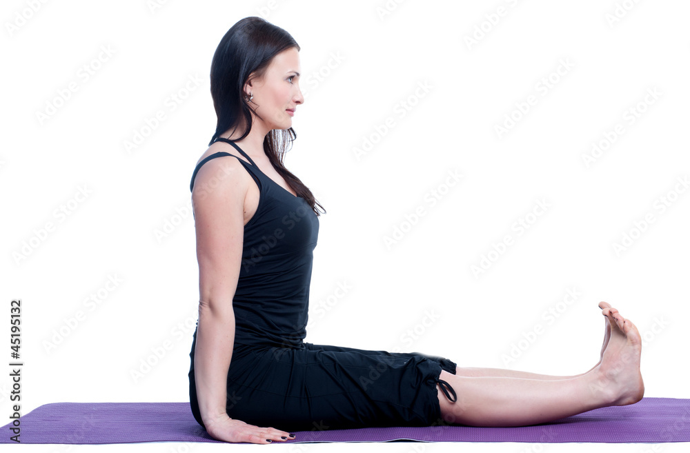 woman in a traditional yoga pose on white background woman in a traditional yoga pose on white background