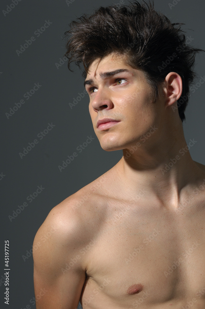 Young man Portrait on gray