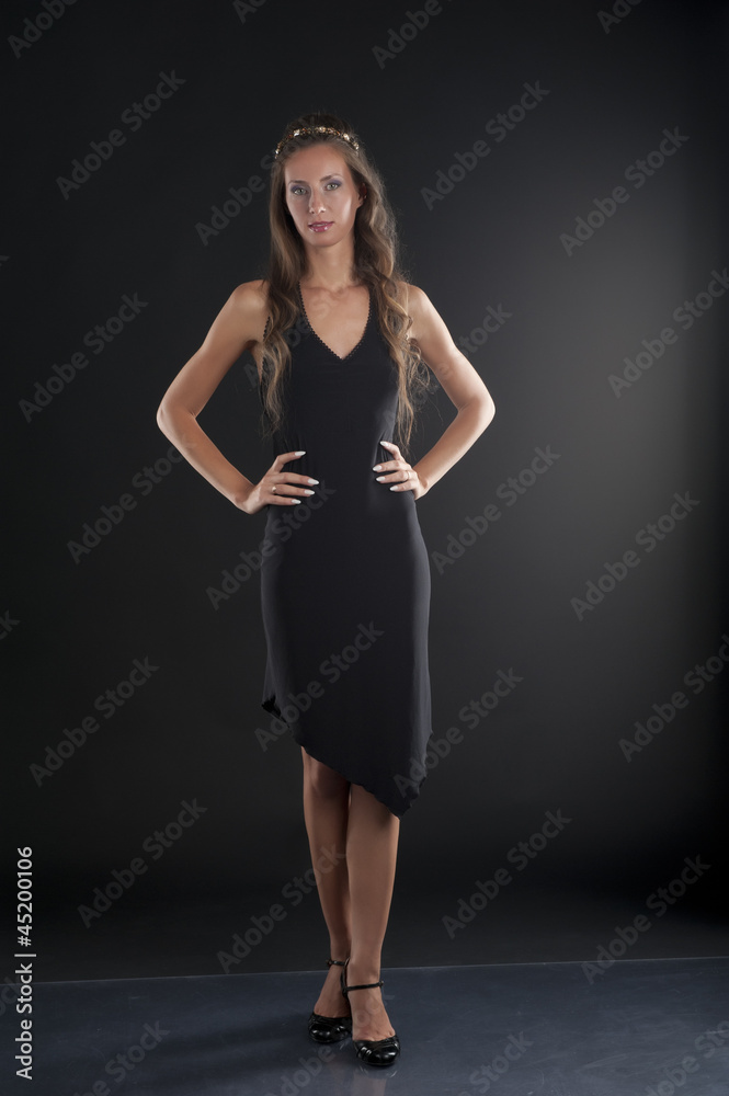 A young woman in a black dress