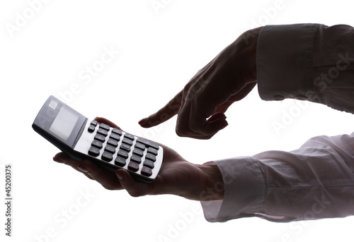 silhouette of woman's hands with calculator isolated on white .