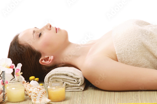 An attractive young woman receiving spa treatment