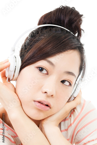 Beautiful young woman listening to the music