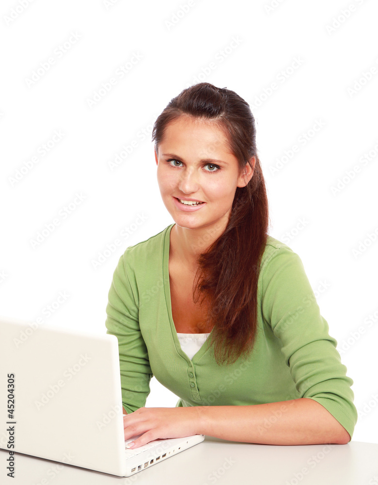 A young college girl sitting in front of a laptop A young college girl sitting in front of a laptop