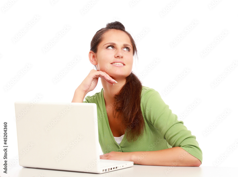 A young college girl sitting in front of a laptop A young college girl sitting in front of a laptop