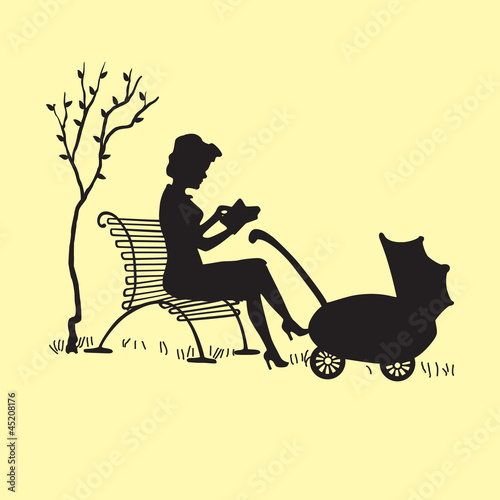 Silhouette of a young mother with a carriage