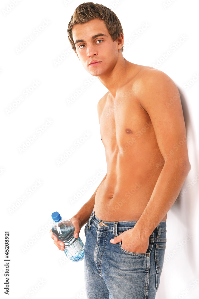 A young handsome guy with a bottle of water A young handsome guy with a bottle of water