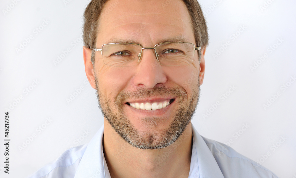Portrait of the smiling man isolated on white background Portrait of the smiling man isolated on white background