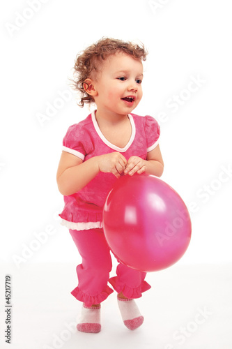 a little cute girl with a balloon