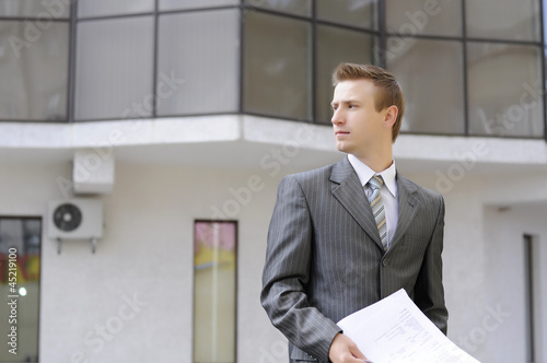 businessman holds contracts