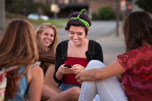 Hispanic Teen with Friends and Phone