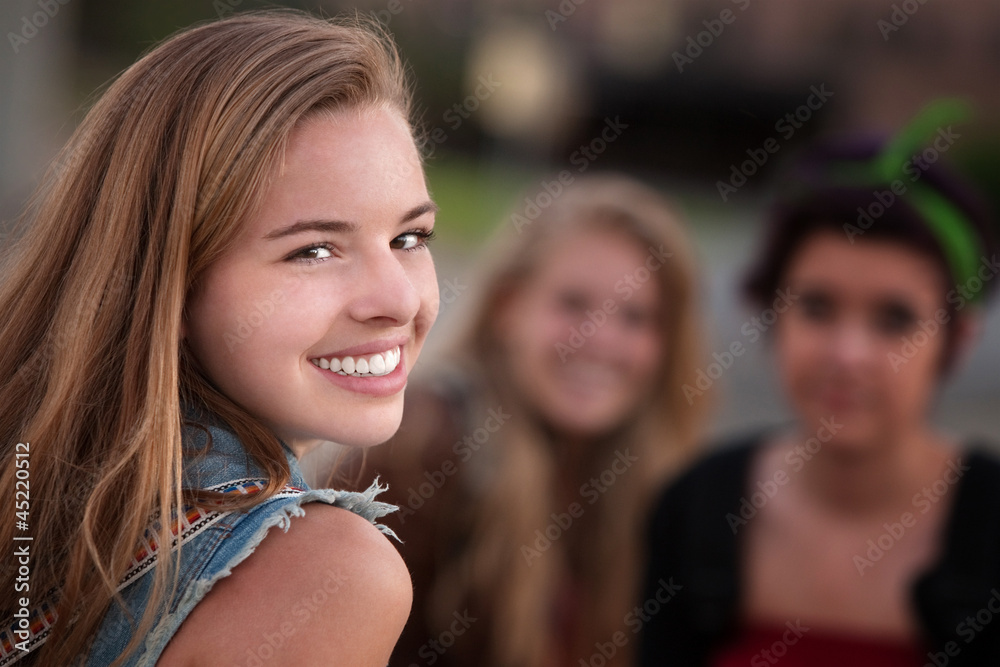 Smiling Teen Girl with Two Friends Smiling Teen Girl with Two Friends