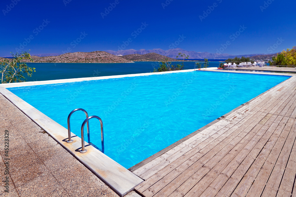 Blue swimming pool at Mirabello Bay in Greece Blue swimming pool at Mirabello Bay in Greece