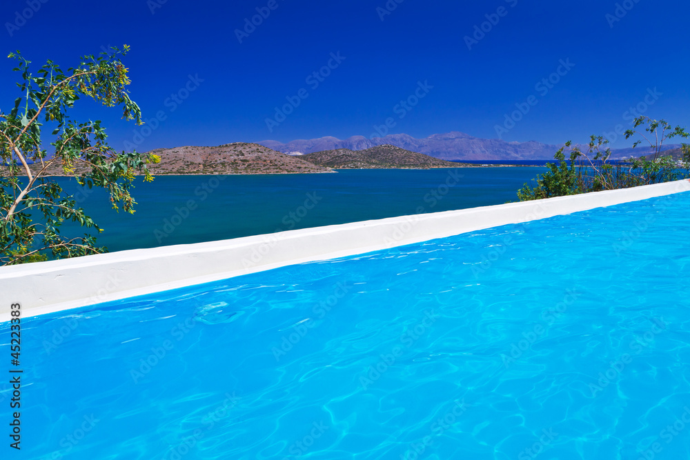 Blue swimming pool at Mirabello Bay in Greece